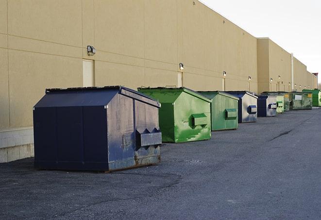 dumpsters lined up for use on busy construction site in Douglas